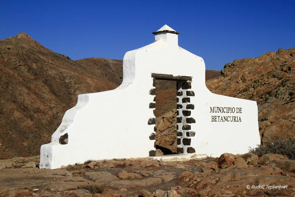 Traditional municipality sign (white arch gate) near Betancuria