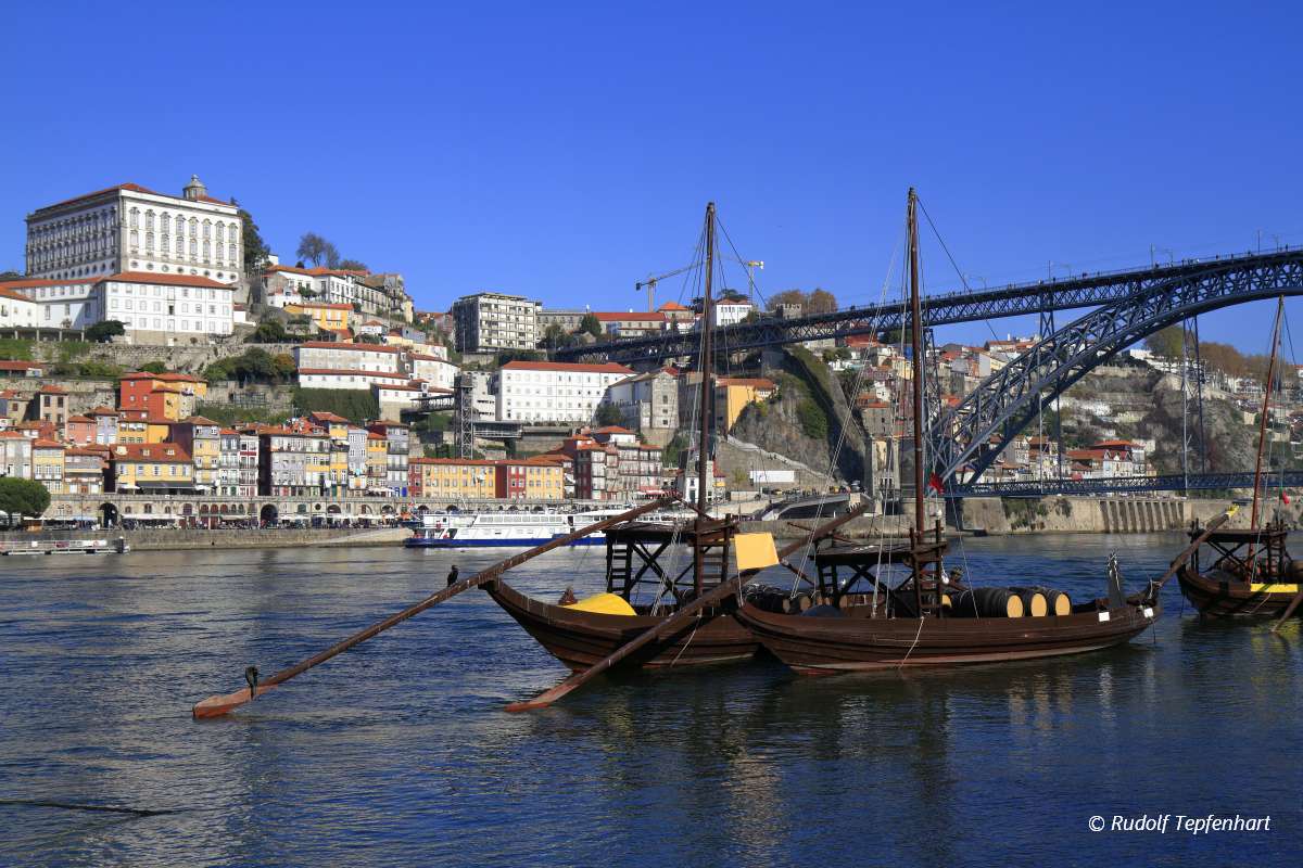 Traditional rabelo boats, Porto city skyline, Douro river and an