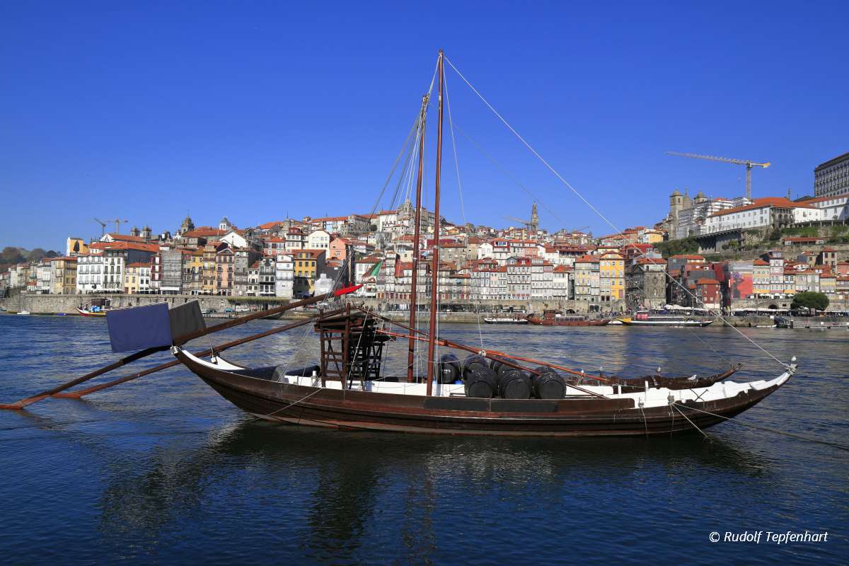 Traditional rabelo boats, Porto city skyline, Douro river and an