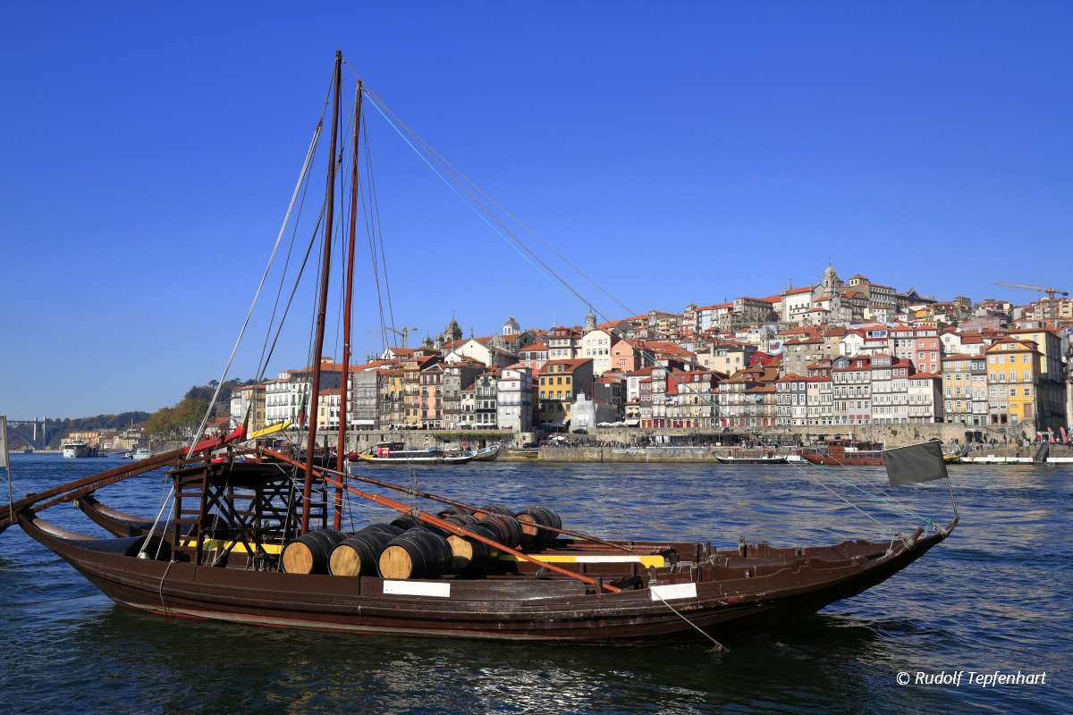 Traditional rabelo boats, Porto city skyline, Douro river and an