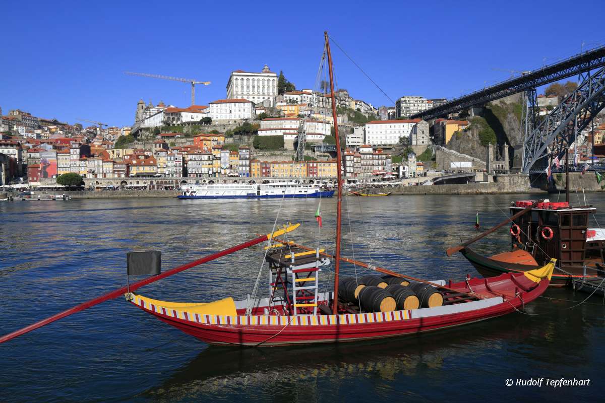Traditional rabelo boats, Porto city skyline, Douro river and an