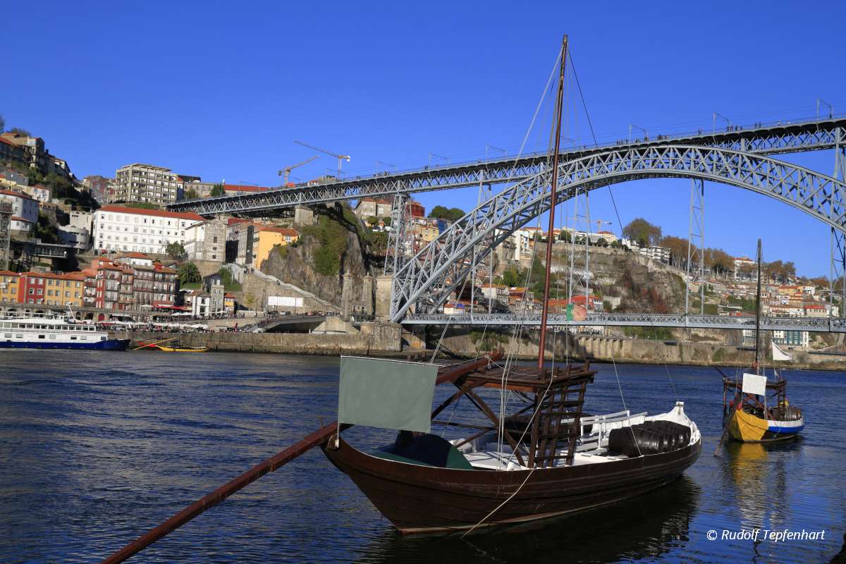 Traditional rabelo boats, Porto city skyline, Douro river and an