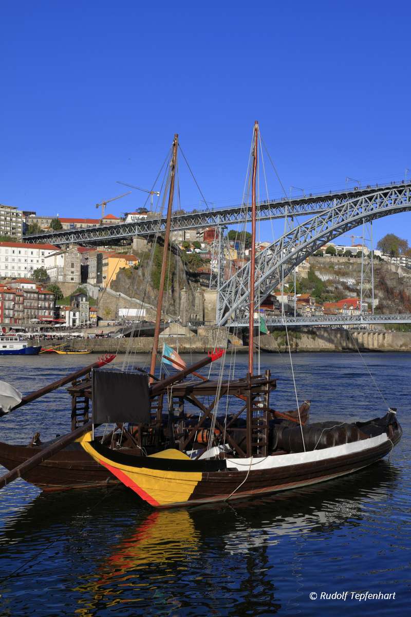 Traditional rabelo boats, Porto city skyline, Douro river and an
