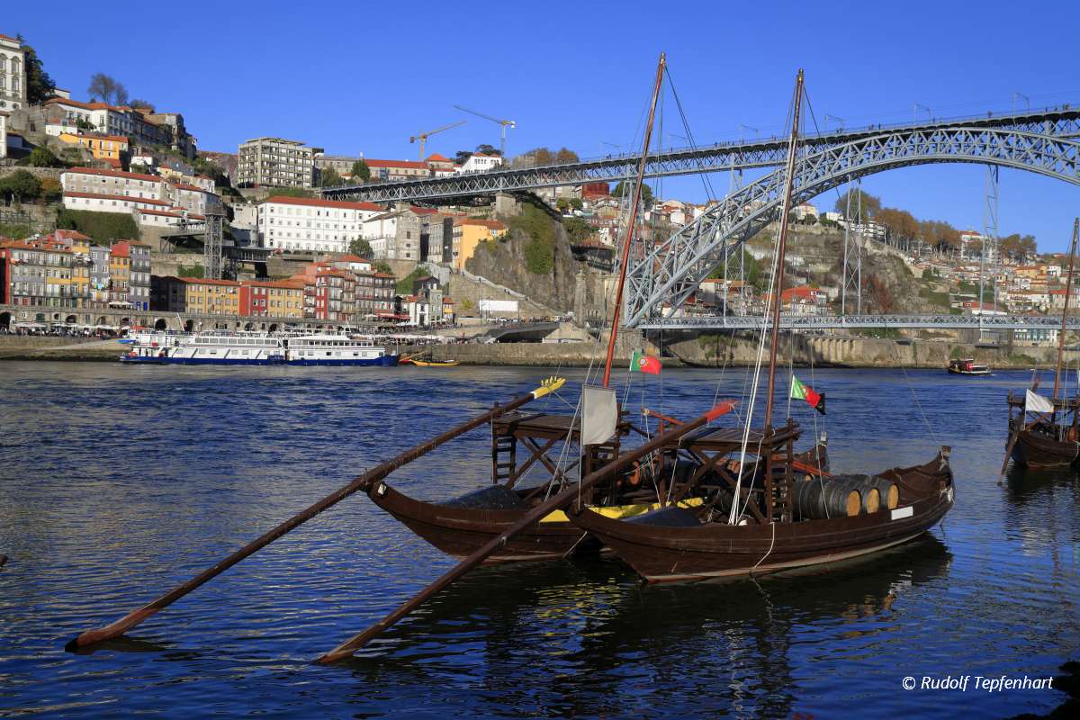 Traditional rabelo boats, Porto city skyline, Douro river and an