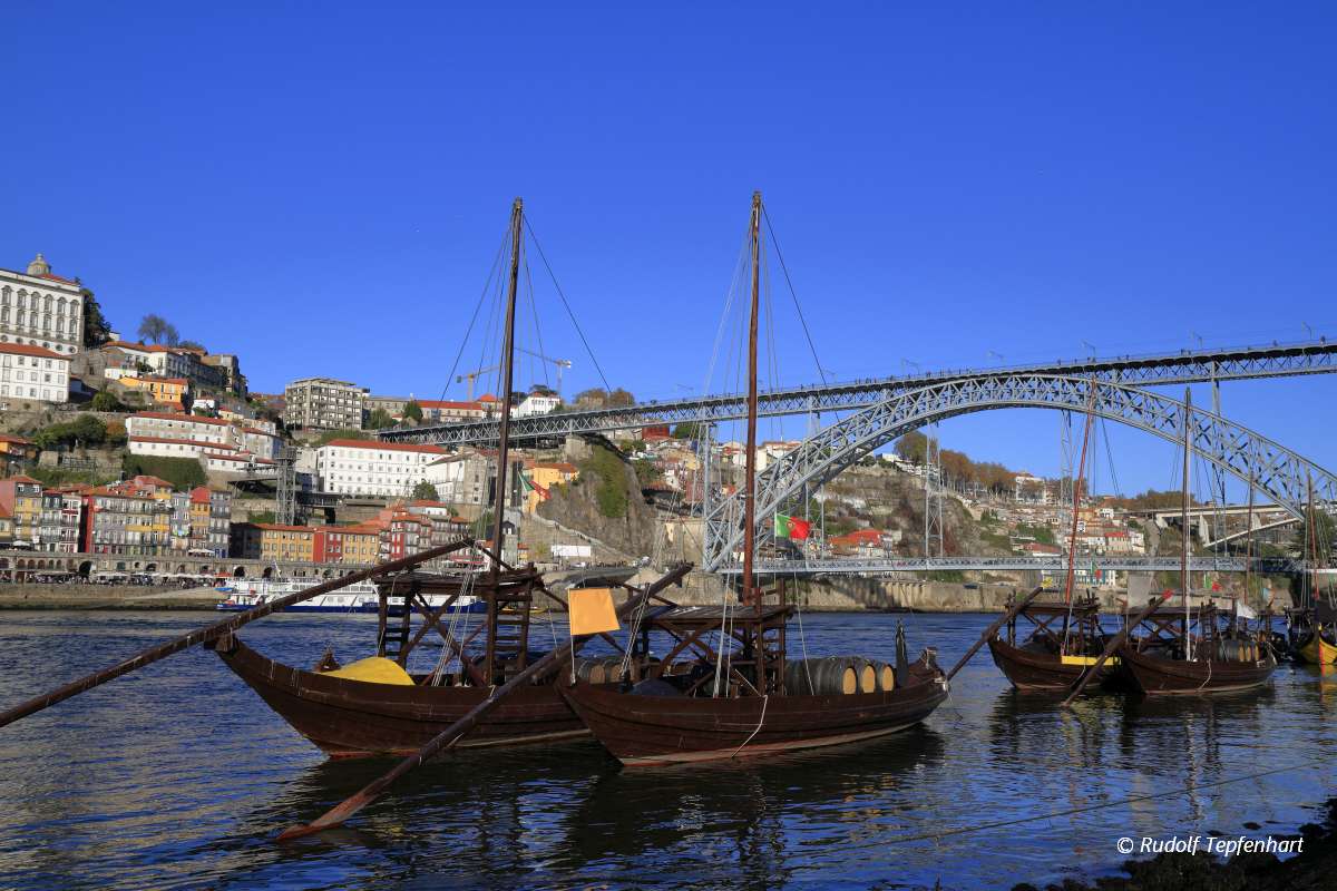 Traditional rabelo boats, Porto city skyline, Douro river and an