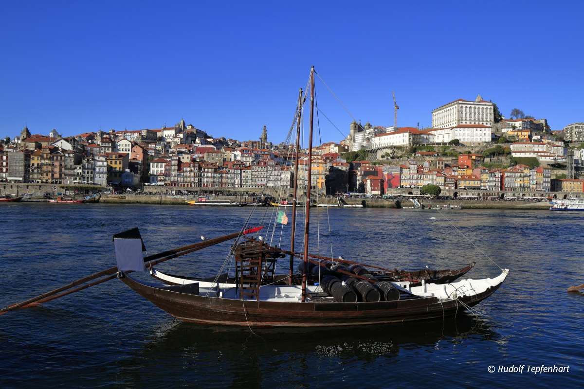 Traditional rabelo boats, Porto city skyline, Douro river and an