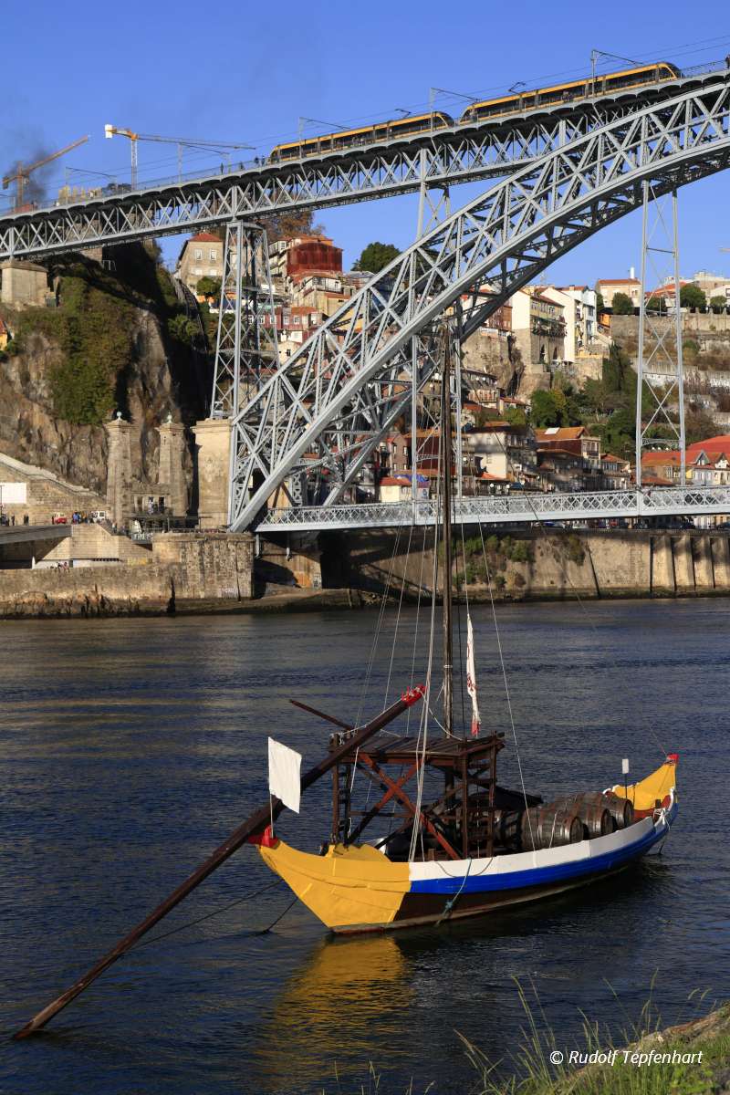 Traditional rabelo boats, Porto city skyline, Douro river and an