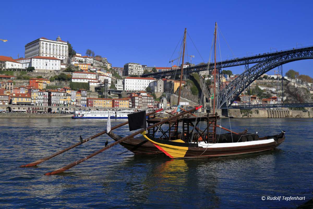Traditional rabelo boats, Porto city skyline, Douro river and an